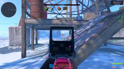 Rust first-person view aiming through a sight toward a snowy structure.